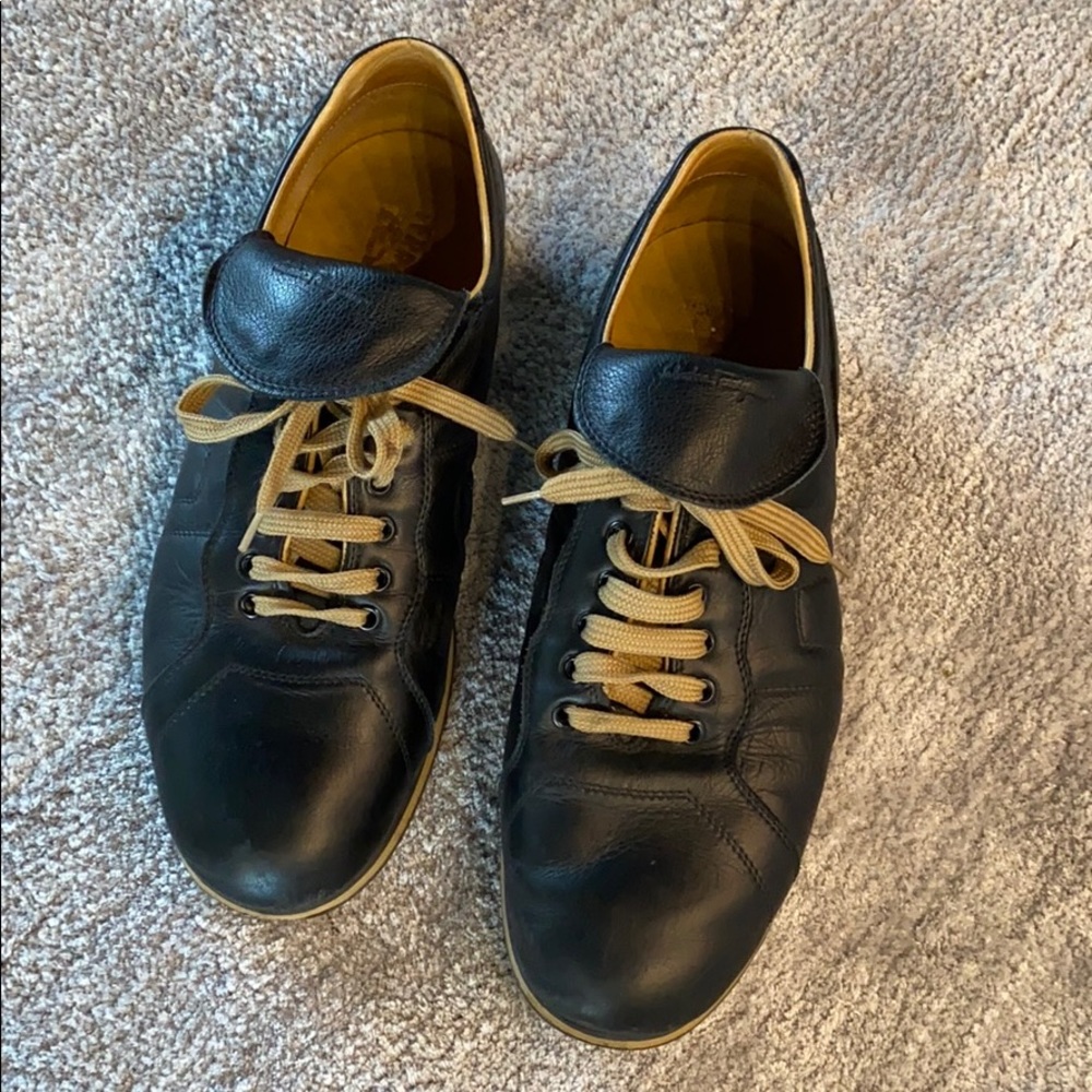 Black Ferragamo leather sneakers.